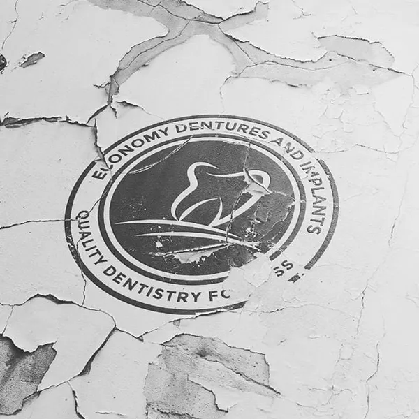 Economy Dentures and Implants dental clinic logo design by Chachir
